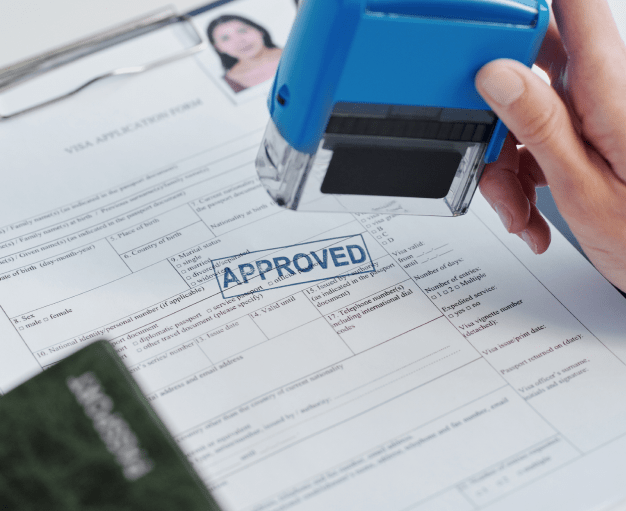 Stamp on immigration document stating 'approved'